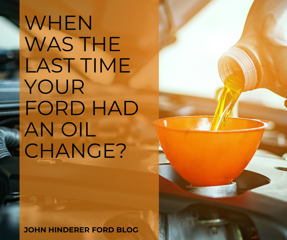 A photo of motor oil being changed and the text: When Was the Last Time Your Ford Had an Oil Change? - John Hinderer Ford Blog